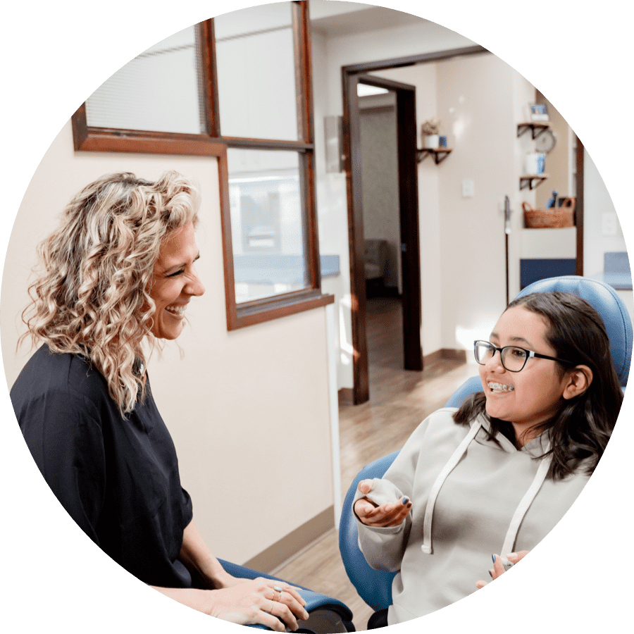 young patient and team member laughing